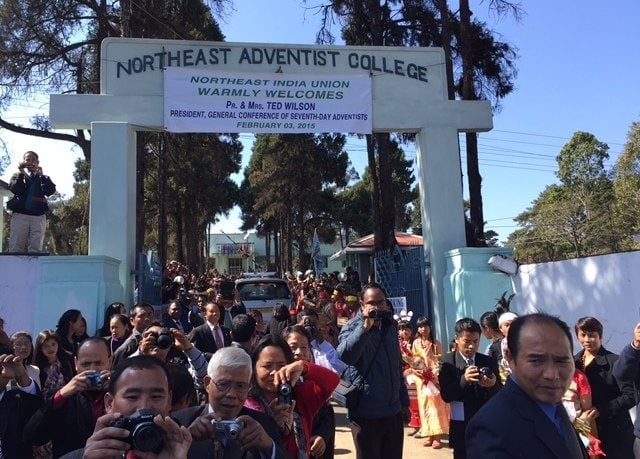 People welcoming Adventist Church leader Ted N.C. Wilson and his wife, Nancy, to Northeast Adventist College.