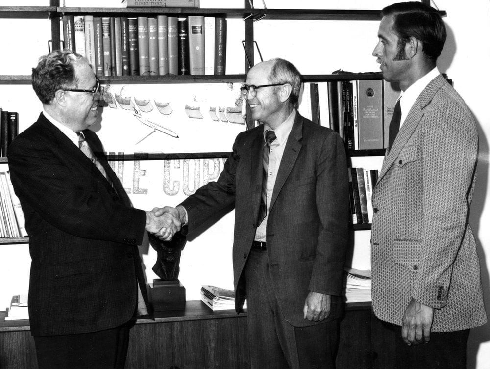 <strong>ALMA MATER:</strong>  Andrews University president Richard L. Hammill, center, greeting J. Edward Hutchinson, a member of the U.S. House of Representatives from Michigan, as Lee Boothby looks on at the university on July 31, 1972. Credit: Center for Adventist Research Image Database