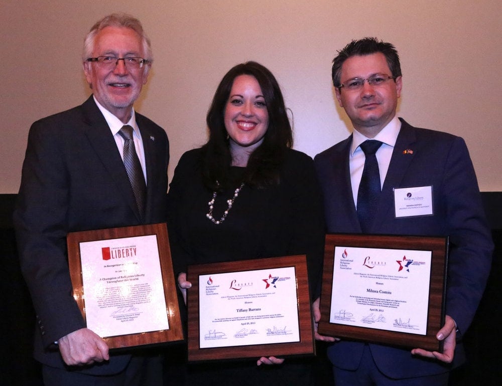 John Graz, left, director of the Adventist Church’s religious liberty department, posing with the dinner's national award recipient, Tiffany Barrens, international legal director of the American Center for Law and Justice; and its international award recipient, Mihnea Coutoiu, a Romanian senator and university president. (Mylon Medley / ANN)