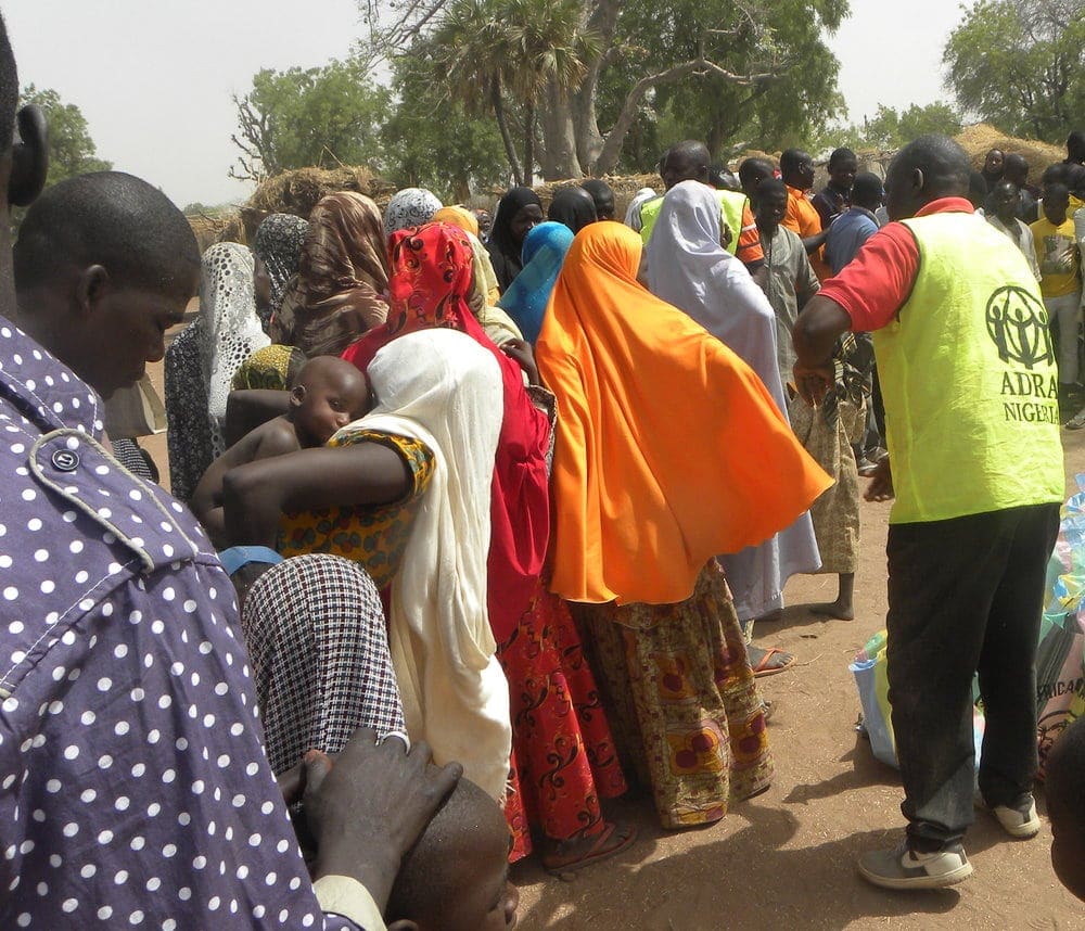 Internally displaced people lining up for food aid in the restive Adamawa state. All photos: ADRA 