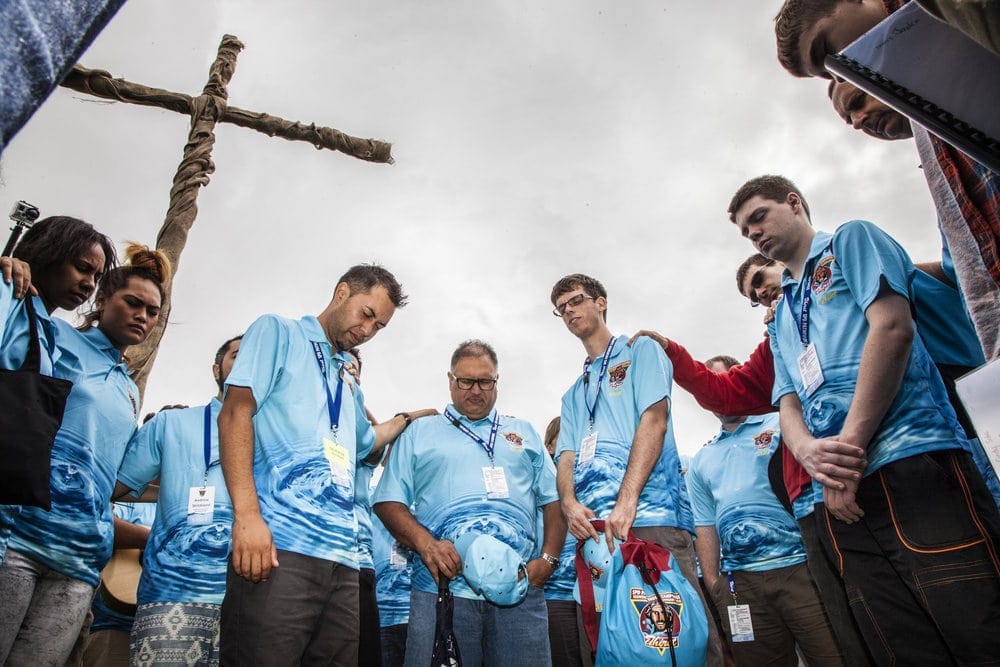 Camporee staff members coming together for prayer. Photo: Charmaine Patel / Adventist Record