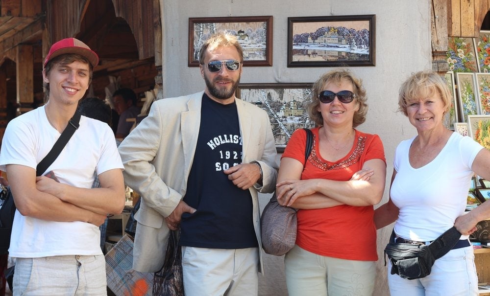 Akim posing with his parents, Oleg and Elena Zhigankov, center, and an aunt for a photo by Aimee Grace Tapeceria, the author of this article, during a trip to Russia on May 21, 2014. A group of people from AIIAS toured Russia last summer.