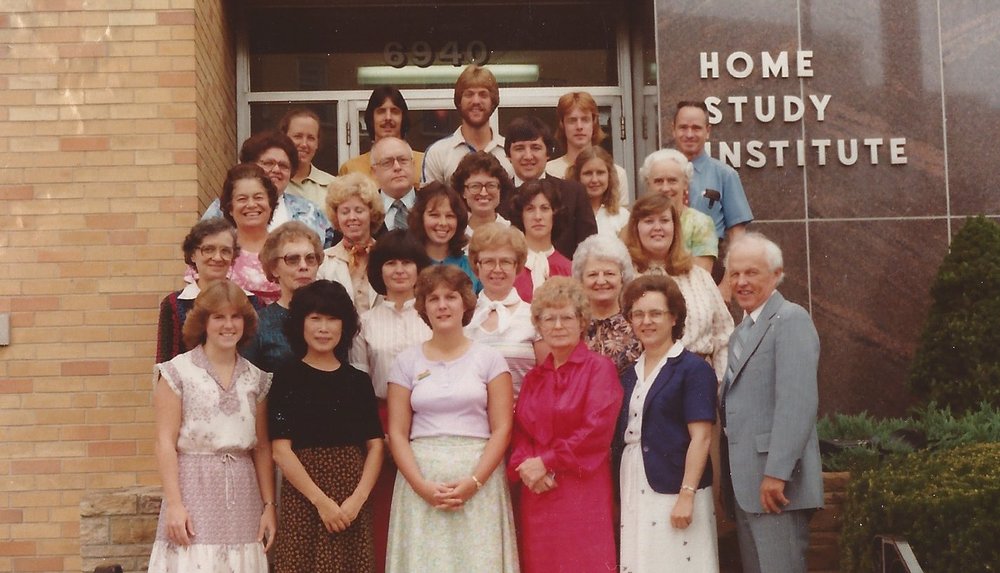 Delmer Holbrooke, right, posing with the Home Study Institute team. Photo: Charlotte Conway