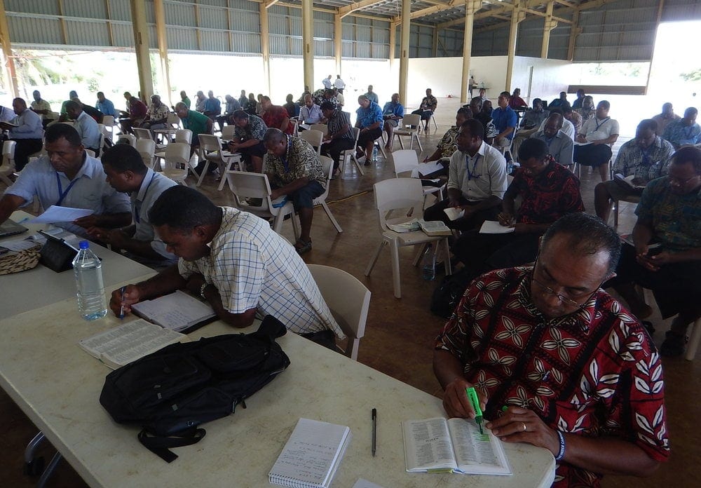Pastors taking notes during a seminar led by Caesar on the South Pacific island of Fiji.