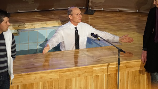 Ted N.C. Wilson, president of the Seventh-day Adventist World Church, addresses the congregation after he baptized 6 people during the Total Member Involvement evangelistic campaign in Bucharest Romania [photo credit: Emily Mastrapa/ANN]