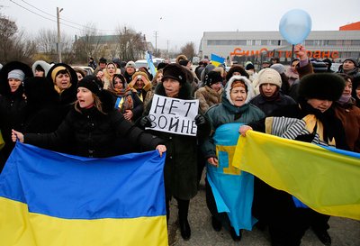 Crimean Tatars hold a banner that reads, “No War” during a pro-Ukraine rally in Simferopol, Crimea, Ukraine on March 10. A Turkic ethnic group, Tatars make up 12 percent of Crimea’s population, the majority of which is ethnic Russian. [photo: Darko Vojinovic/copyright Associated Press]
