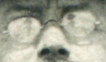 A blurry reflection in Willie White’s eyeglasses appears to show the photographer wearing a large women’s hat.