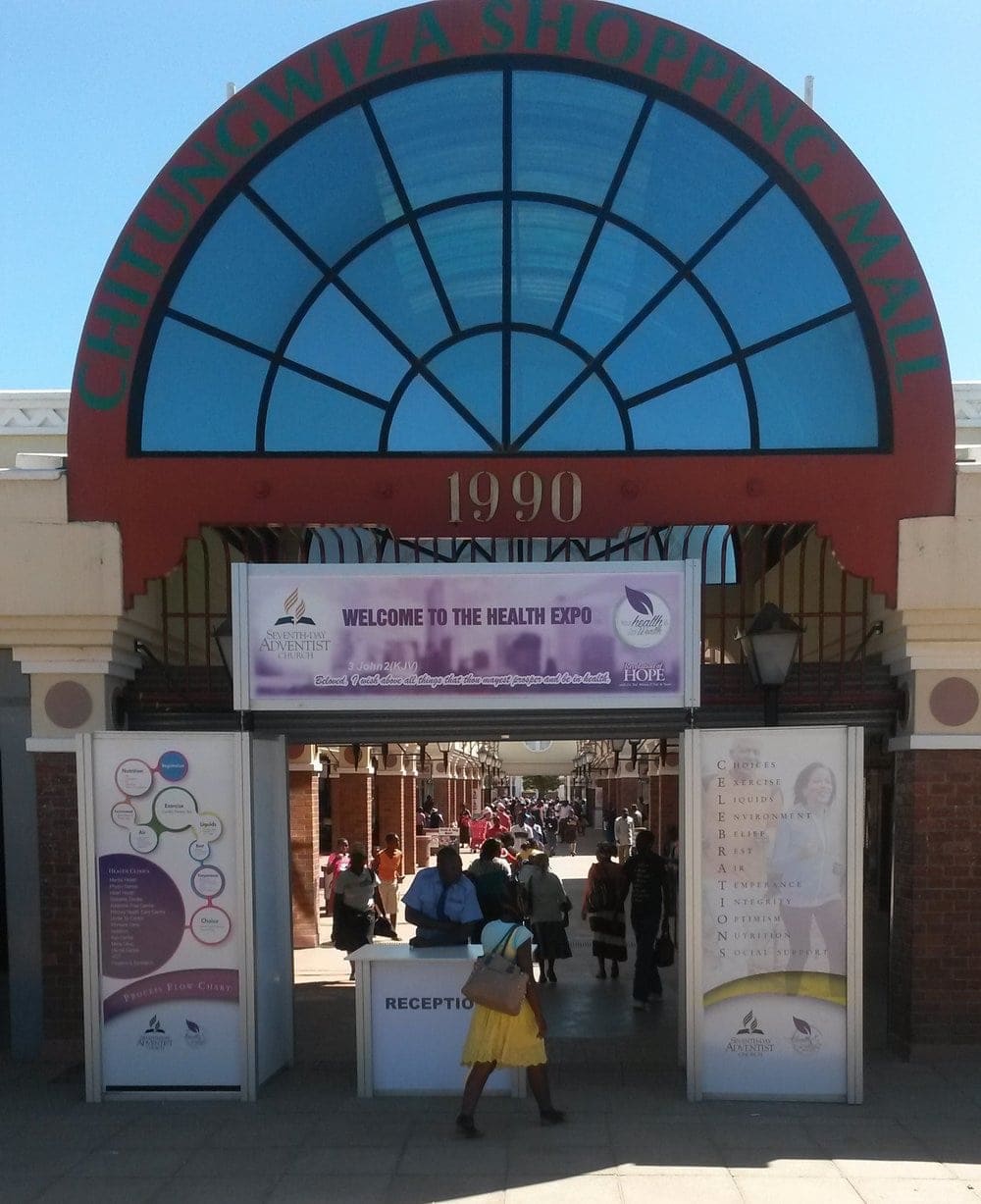 A purple sign hanging above the entrance to the shopping center bears the name of the Seventh-day Adventist Church and reads, "Welcome to the Health Expo: Beloved, I wish above all things that thou mayest prosper and be in health (3 John 2)." All photos courtesy of Alexis Llaguno
