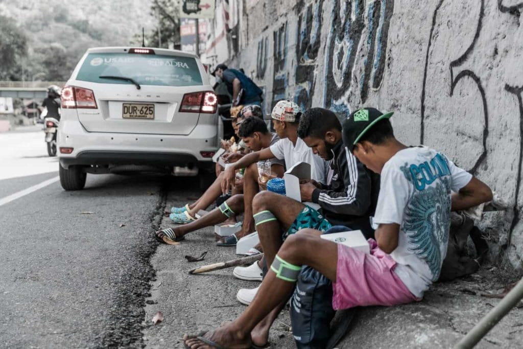 Refugee Photo Venezuela Men with food 2 1536x1024 1